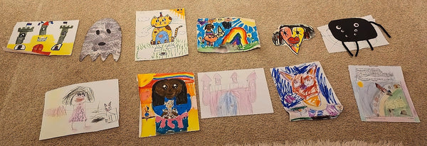 A child's drawings laid out, ready to become a storybook